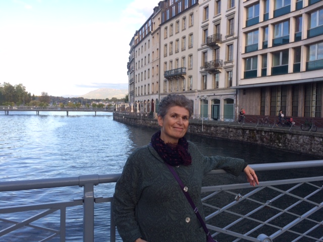 Inera founder Irina Golfman standing on a bridge overlooking a river