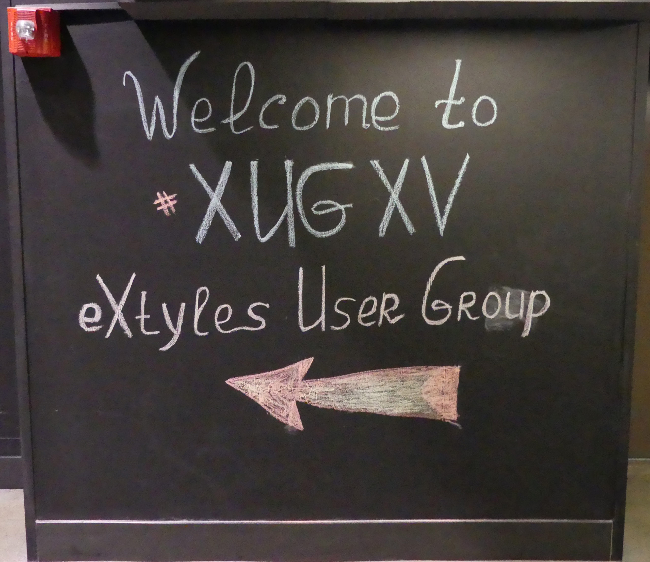 Chalkboard wall art reading "Welcome to XUGXV"