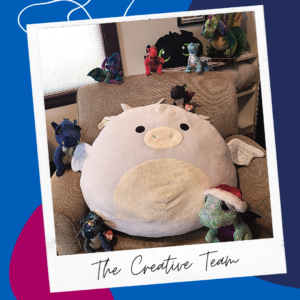 Image: A collection of various-sized stuffed dragons on a chair in a polaroid that reads "The Creative Team"